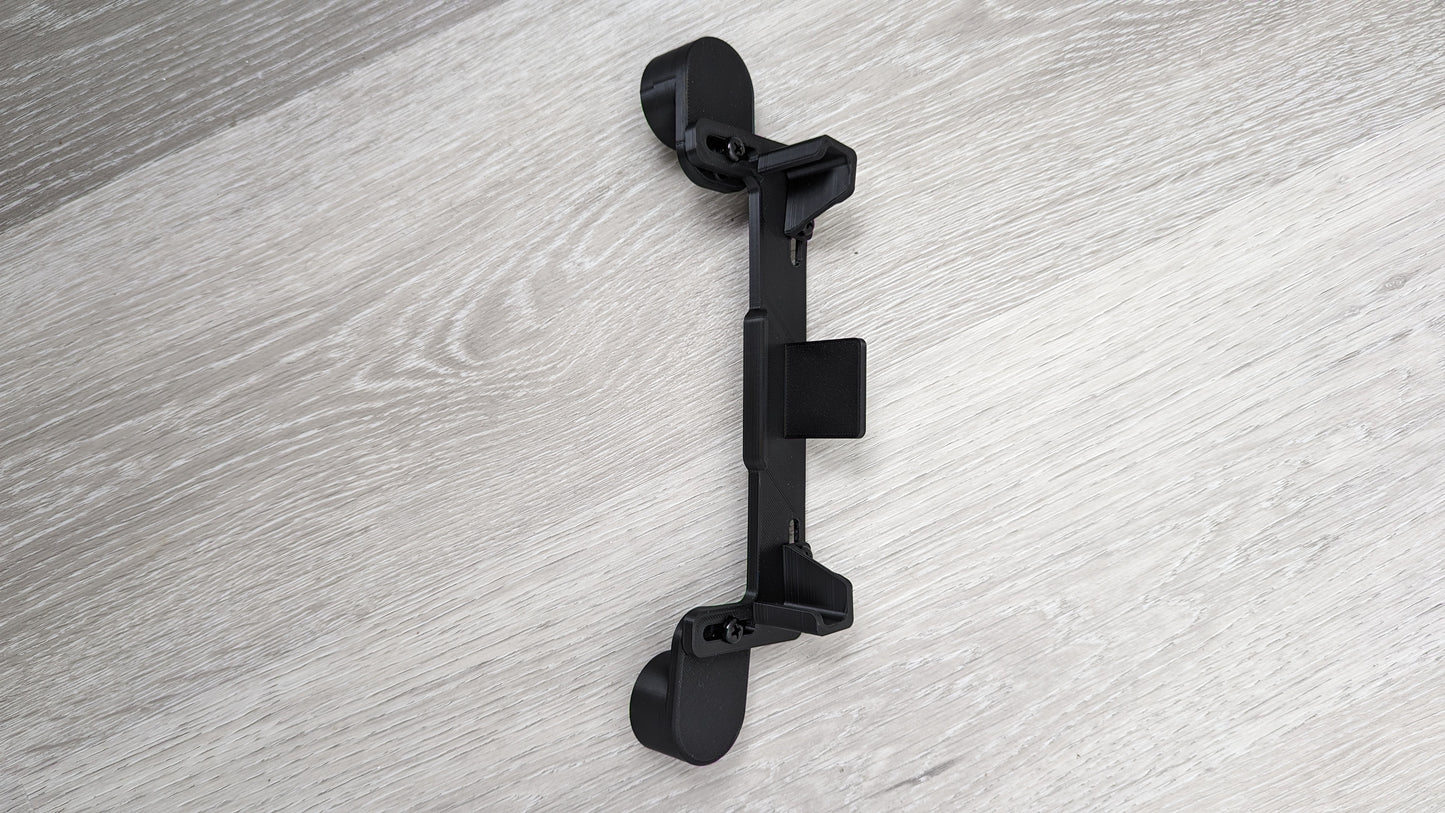 Dashboard Phone Holder Mod for Logitech G29, G923, G920, and G27 Racing Wheels in black color on a wood backdrop.