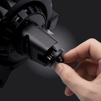 Person connecting an Emulator for Fanatec to enhance wheel functionality and support third-party wheels.